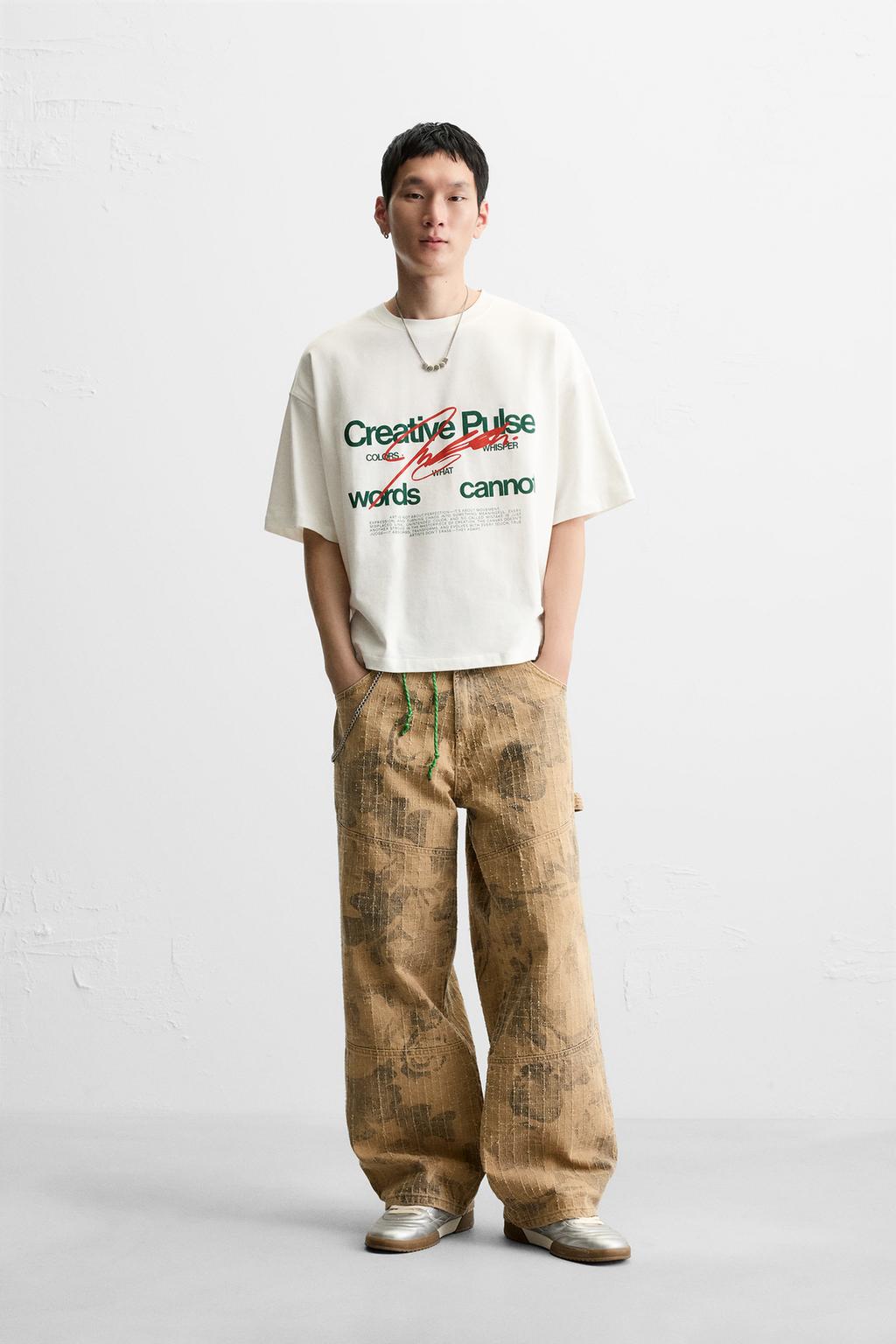 White T-shirt set with 'Creative Pulse' text and brown trousers with abstract print.
