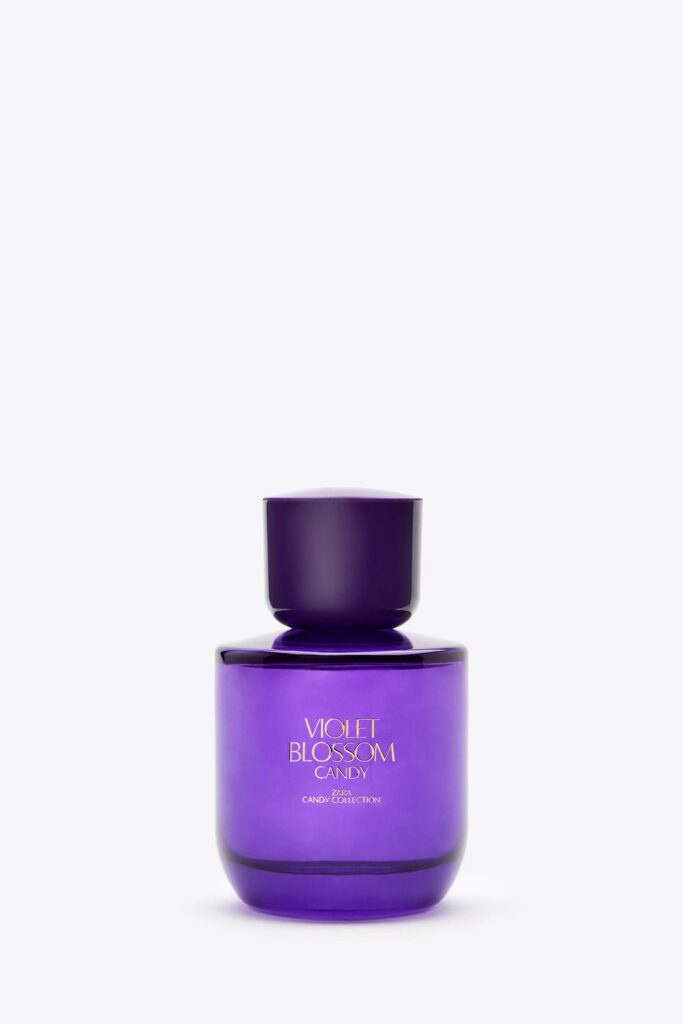 Purple perfume bottle with text 'Violet Blossom Candy Zara Candy Collection'.