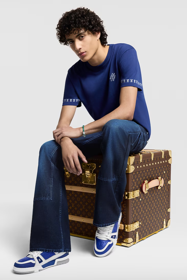 White men in Louis Vuitton Box with blue t-shirt and sneakers