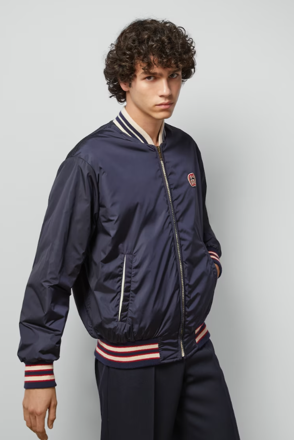 Man wearing a Retro Sportwear Reversible Nylon Canvas Jacket