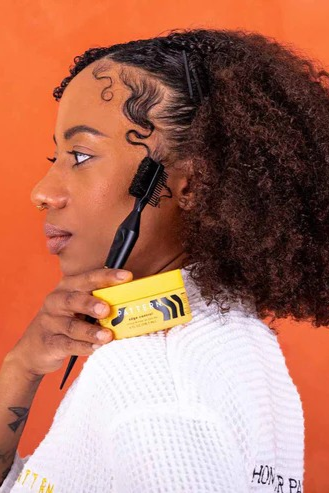 Women Showing Edge Control Duo on her Shoulder | Briondi