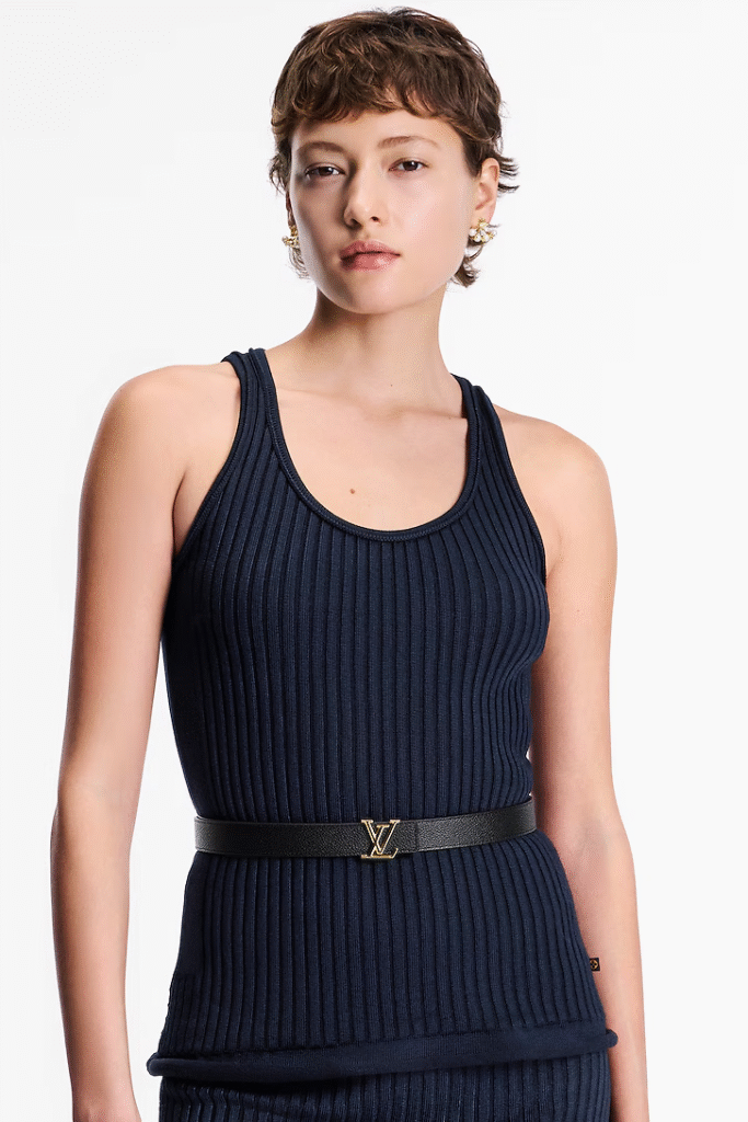 Model wearing a navy ribbed tank top styled with the Louis Vuitton Iconic 25mm Reversible Belt.