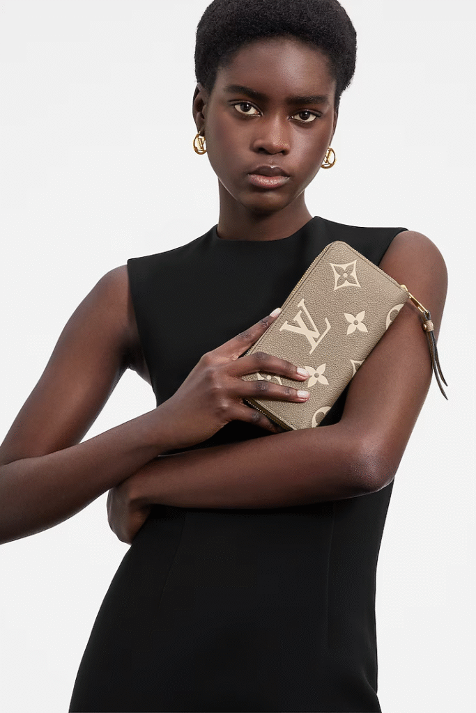 Women In Black Dress With Louis Vuitton Zippy Wallet | Briondi