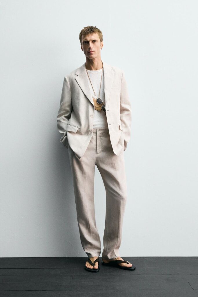 Model wearing Zara bright pink linen suit blazer