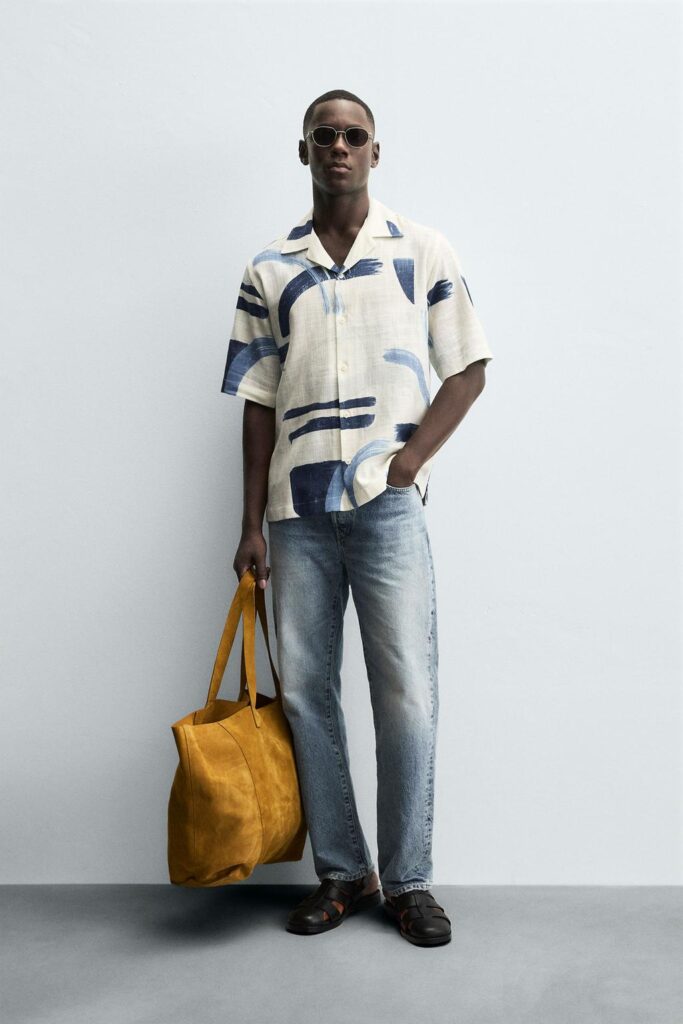 Men wearing a Zara Abstract Print Shirt with A bag in hand
